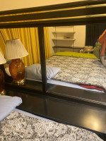 black and gold bedroom set and teak sofa