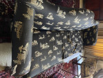 Camelback Sofa with carved wood detail