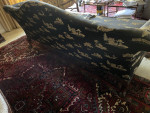 Camelback Sofa with carved wood detail