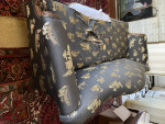 Camelback Sofa with carved wood detail
