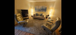 2 matching Ekornes chairs with ottomans, West Elm sofa