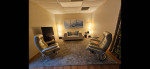 2 matching Ekornes chairs with ottomans, West Elm sofa