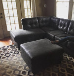 3 piece sofa, ottoman, and rug.