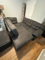 3 piece sofa, ottoman, and rug.