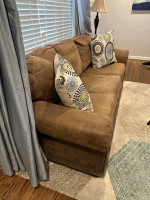 Matching taupe/light brown faux leather nailhead sofa and rocking recl