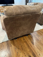 Matching taupe/light brown faux leather nailhead sofa and rocking recl