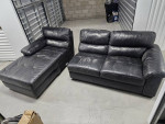Jeromes black genuine leather sectional sofa