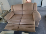 Sofa and love seat all 4 sides recliner almost New!