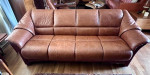 Model: Oslo 4-Seat Sofa; caramel color leather with Walnut stain wood