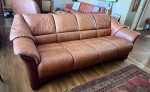 Model: Oslo 4-Seat Sofa; caramel color leather with Walnut stain wood
