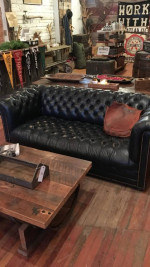 Dark blue leather Chesterfield sofa