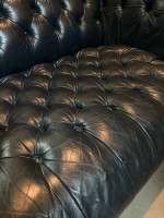 Dark blue leather Chesterfield sofa