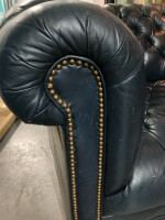 Dark blue leather Chesterfield sofa