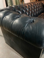 Dark blue leather Chesterfield sofa