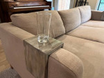Beige L-shaped sofa with chaise and custom arm tables