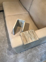 Beige L-shaped sofa with chaise and custom arm tables