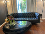 Black faux leather sofa