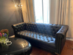 Black faux leather sofa