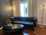 Black faux leather sofa