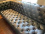 Black faux leather sofa