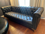 Black faux leather sofa
