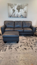 Grey leather sofa loveseat and matching ottoman