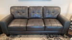 Grey leather sofa loveseat and matching ottoman