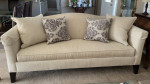 Camelback beige sofa