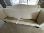 Camelback beige sofa