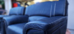 2 LIKE NEW GENUINE LEATHER OVERSIZED SOFA CHAIRS/SCANDINAVIAN DESIGNS