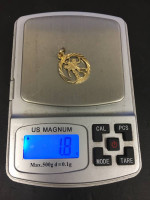 Gold charm pendant