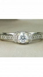 Women’s designer 10K white gold diamond engagement ring.