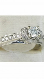 Women’s designer 10K white gold diamond engagement ring.