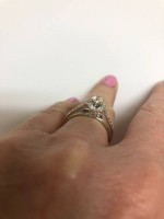 Women’s designer 10K white gold diamond engagement ring.