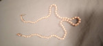 Two sets of pearl necklaces