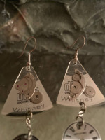 Pierced earrings made from clock parts