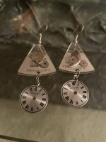 Pierced earrings made from clock parts