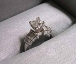 DIAMOND ENGAGEMENT RING IN PLATINUM SETTING W/SIDE BAGUETTES