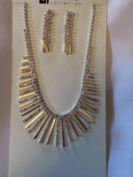 Brand new silver and rhinestone necklace set with earrings.
