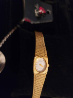 Ladies Gruen Gold Tone Band with Mother of Pearl Dial.