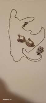 silver necklace and earring together