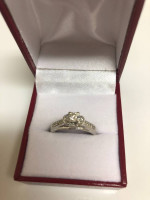 Beautiful diamond solitaire with accent diamonds. White gold setting