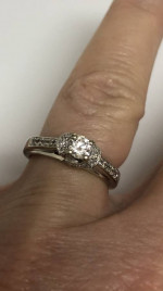Beautiful diamond solitaire with accent diamonds. White gold setting