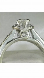 Beautiful diamond solitaire with accent diamonds. White gold setting
