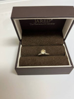 Round diamond solitaire engagement ring. 14K white gold setting.