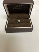 Round diamond solitaire engagement ring. 14K white gold setting.