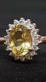Natural canary sapphire and white sapphire halo ring. 14K rose platted