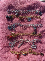 Brand New Charm Bracelets w/ 3 charms