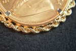 1 OUNCE .999 GOLD KRUGERRAND  IN 14K GOLD W/ROPE BEZEL EXQUISITE