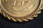 1 OUNCE .999 GOLD KRUGERRAND  IN 14K GOLD W/ROPE BEZEL EXQUISITE